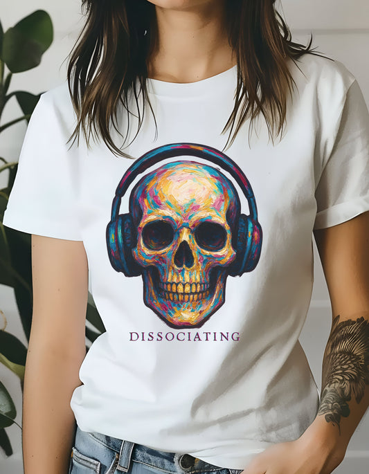 Person wearing a white t-shirt with a colorful skull design and 'Dissociating' text.